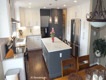 The white and grey kitchen cabinets We opened this kitchen space removing an existing wall, and adding more storage combining two white pantries and gr