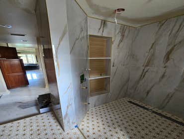 Photos by MC ALISTER TILE #1 5 showers total, was hired after another handyman did not water proof correctly, fixed all water proofing and installed 