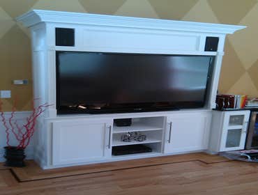 Custom Cabinetry Here is an example of how we took a home entertainment system and built it into a custom cabinet to take it to the next level.