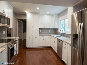 Revitalized Medium White Kitchen For this project, our client wanted to spruce up her kitchen to have something brighter and modern.
White cabinets and