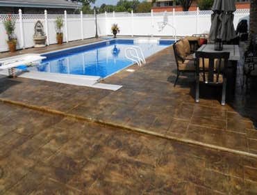 Photos by Stamped Concrete Denver LLC #1 Stamped concrete, often called textured or imprinted concrete, replicates the look of many different stones su