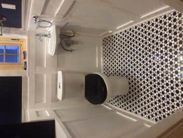 Small powder room, mosaic hight detailed and contrast tiles.