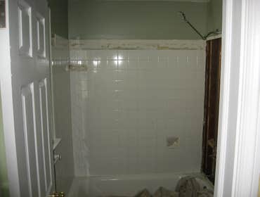 1418 Remington Complete remodel of two small bathrooms for client; using Kohler fixtures and faucets, carrara marble, wainscotting, and Benjamin Moore 
