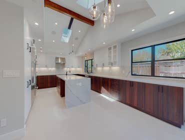 Los Angeles Kitchen Remodel This Los Angeles Kitchen remodel boasts a stunning 10 foot island with a waterfall. Custom hardwood cabinets with quart cou