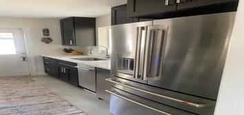 Winter Park Remodel-Mid Century Modern Before and after; full remodel, install rectified tile flooring, full paint, completely new kitchen with quartz 