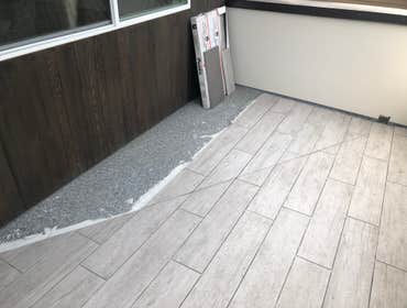 Photos by Dun Rite Remodel LLC #5 The pictures don't do this tile the proper justice! Here we installed 6" by 48" barn wood style plank tile in a $1.6 