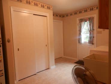 Interior Motivez Painting Family room painted in Crushed Peanut. Cathedral accent wall painted in Stone Harbor.
Kitchen and dining area painted in It