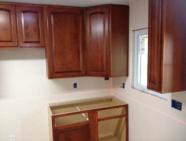 Adam R. Nardecchia Electrical Service Project In the first few pictures is a brand new maple kitchen being installed with custom counter tops which are
