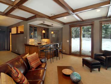 Lockridge Residence This new Transitional Custom Home was built on the owners heavily wooded lot and designed to maintain the woodsy feel while taking 