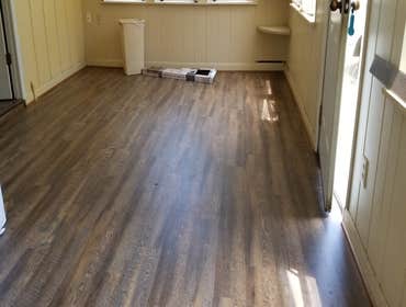 Vynl plank flooring Customer had a rental property that she was fixing-up due to water damage after the storm. We installed roughly over a thousand squ