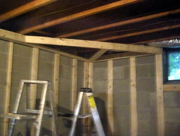 Project 1, building a basement with a powder room, Project 2, restoration of ceder shingles & shutters Framing over concrete, installing electric ligh