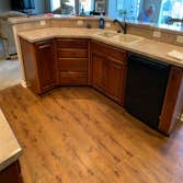 Custom cabinets, island, and floors
