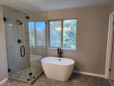 Park City Residential Bathroom Remodel Transforming this primary bathroom involved a complete renovation, featuring sleek new tile flooring, modern sho