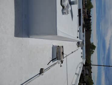Photos by 99 Restoration LLC #3 Remove and replace Foam roof with a taper system and tpo. THis roof was about 35 yrs old and was ready for a new face l