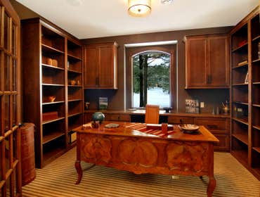 Lockridge Residence This new Transitional Custom Home was built on the owners heavily wooded lot and designed to maintain the woodsy feel while taking 