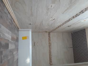 12x 24 pollished travertine wall tile on a third off set.