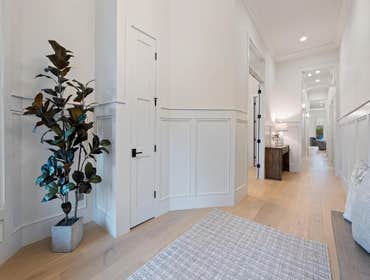 Foyer with custom paneling and high ceilings preserved and renewed by CJMC Build in 12 South, Nashville.