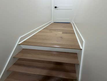 Photos by Germantown Hardwood Floors #15 Sanding and varnishing of the steps, matching the color to that of the existing floors.
