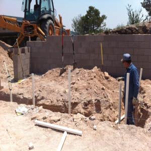 Nice little project in the mountains of Ojo Caliente Eddie senior in the trenches roughing-in some drainage pipe.