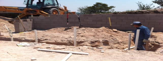 Nice little project in the mountains of Ojo Caliente Eddie senior in the trenches roughing-in some drainage pipe.