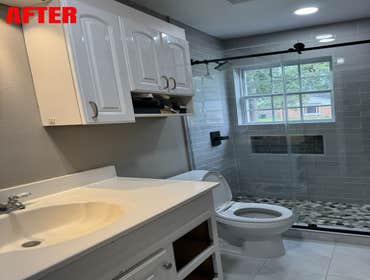 Photos by Knight Roofing General Contractors, LLC #1 This bathroom was taken down to the studs and completely rebuilt to create a clean, modern, and fu
