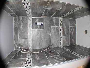 All Pro Home Design-Ted George Bathroom Project This is a custom shower with 12 x 24 wall tile and two rows of 4" accent tile & acrylic shower base.