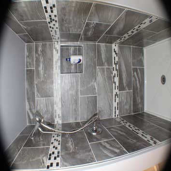 All Pro Home Design-Ted George Bathroom Project This is a custom shower with 12 x 24 wall tile and two rows of 4" accent tile & acrylic shower base.