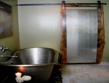 Stainless Steel soaking tub with Barn Door shower enclosure