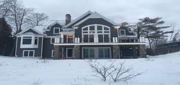 Elk Rapids residential home Framed,siding,roofing,and decks by Jim's Precision Builders