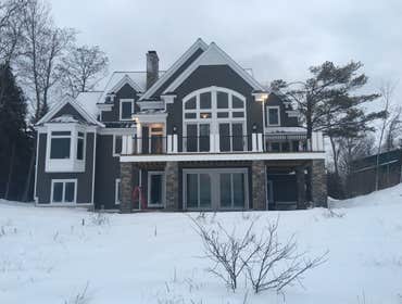 Elk Rapids residential home Framed,siding,roofing,and decks by Jim's Precision Builders