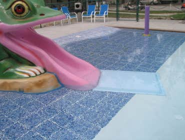 Infinity Edge swimming pool Charlottesville Infinity edge pool with colorized plaster, water feature, tanning shelf, seating benches w/ jets, beach ent