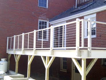 Historic West End condo remodel Complete remodel all finish materials used were reclaimed salvage lumber. Deck is made of aluminum decking with a stain