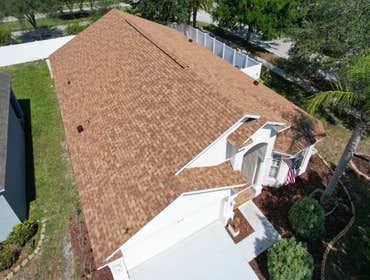 Photos by WOODSTONE ROOFING