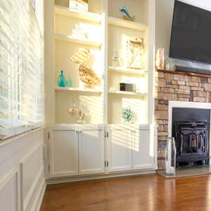 Custom Built-Ins & Stone Fireplace Living Room Fireplace with Natural Stone, Wood Burning Stove, Mahogany hand carved mantle and ceramic tile...