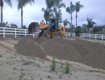 Dirt import for horse arena