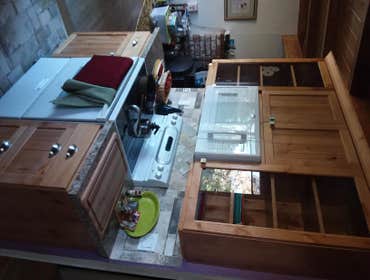 Kitchen and Bathroom Remodel Complete tear out. New framing, plumbing electrical, cabinets, windows, sheet rock, exterior siding. Convert bathroom from
