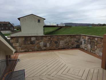 Trex deck NEPA New Trex Deck herringbone design and cultured stone wall.