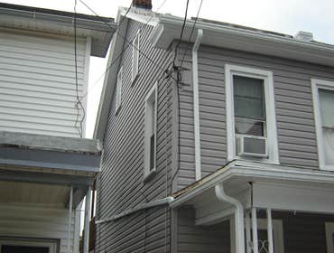 Swank Home Makeover A 2.5 story, single-family home: Siding, windows, insullation, soffit, fascia, capping. Also, repaired fence damage, installed new