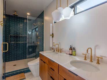 Goodland Bathroom Remodel Discover our completed bathroom remodel featuring a clean, modern design with elegant gold finishes and striking blue tile, r