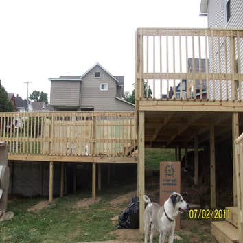 Outside deck This is a deck we built July 2011. It came off the house and around the pool.
