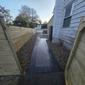 Photos by Rojas Landscaping & Handyman Services LLC #1 Preasure Threated Wood Horizontal Fence Installation
Exterior Fire Place
Paavers Patio/walkway