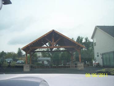 (2) Custom designed timber-framed pergola, timber-framed carport Each timber is hand carved to fit into the joining beam.
