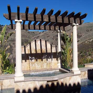 Photo(s) from CUSTOM DERIAN POOLS Infinity Pools, Hillside Pools, Landscaping, BBQs, Outdoor Fireplaces, Shade structures, Pergolas, Landscaping, Mason