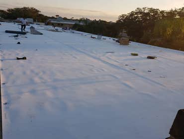 TRKSEIERT TPO Roof system Days Inn in Kissimmee Replacing old gravel roof with New TPO roof system