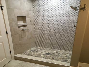 Photos by Thomas Elliott #1 2100 sf home with partially finished pre-cast concrete basement. This home has wood flooring, custom woodwork, tile and cab