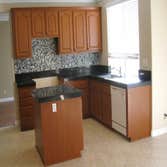 Monrovia kitchen cabinet reface This is a beautiful cabinet refacing job done in classic cherry color with with stylish arched upper doors (AL757) and 
