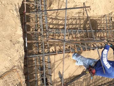 Mount Washinton Hillside land development including caissons/piles, grade beams, CMU block walls, retaining walls. All known as foundation and structur