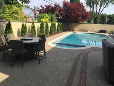 Exposed aggregate Pool deck photo Potoroka Concrete, Project Warren MI