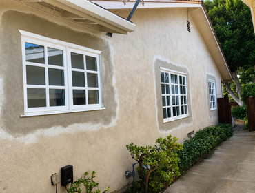 Photos by Eliteblvd Construction #19 This exterior remodeling project included the installation of new white-framed windows and French-style patio door