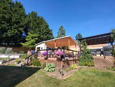 Photos by Stewart & Son Gate & Fence LLC #1 Tiny House with pergola. Small house 17' by 12' small bathroom with pocket door, and small sink with water 